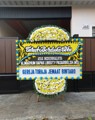 Papan Bunga Duka di Manuhing Raya